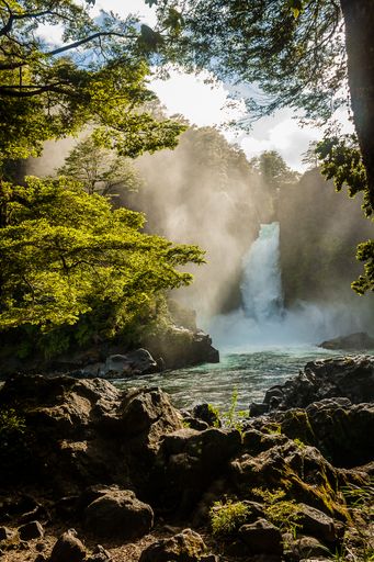 A vertical shot of Huilo Huilo waterfall in southern Chile
