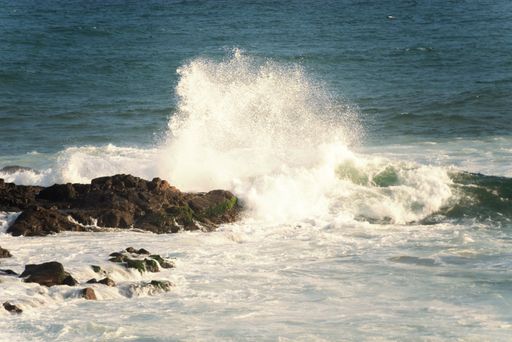 A view of sea waves breaking on the beach rocks in Salvador, Bahia, Brazil