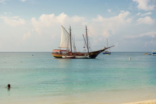 Jolly Pirates sailing vessel seen from Aruba beach. Sea view from Palm Beach, Aruba. Calm ocean view from beach.