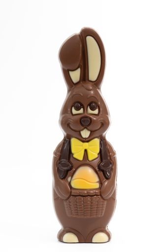 A humorous-looking chocolate Easter bunny is isolated against a white background.