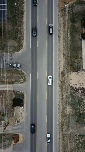 A top view of city traffic on a beautiful highway