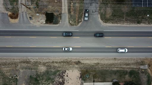 A bird's eye view of a road and driving cars in Colorado