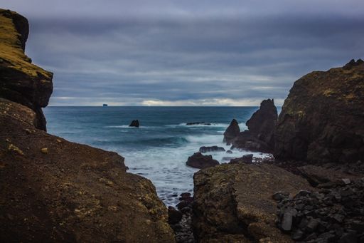 A natural view of the rocky coast and cliffs of Reykjanes in Iceland with long exposure