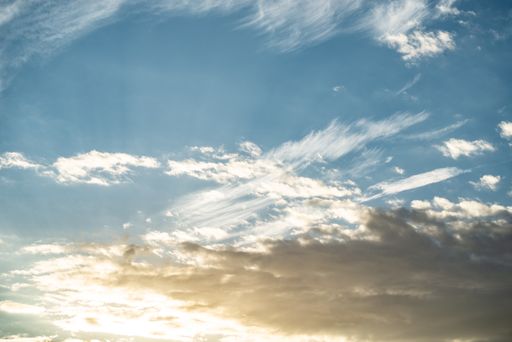 An impressive shot of white clouds in the blue sky on a bright sunny day