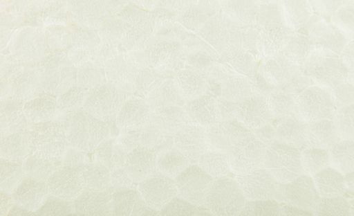 A background of an old crumpled paper background in light green