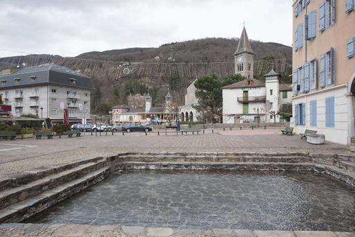 The front part of Hopital St. Louis and Ax Les Thermes natural hot springs on a winter afternoon