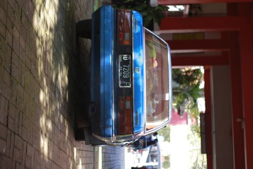 A back of blue Honda corolla in Indonesia