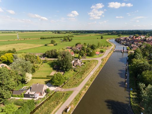 An aerial shot of the Zederik canal near the Arkel village located in the Netherlands