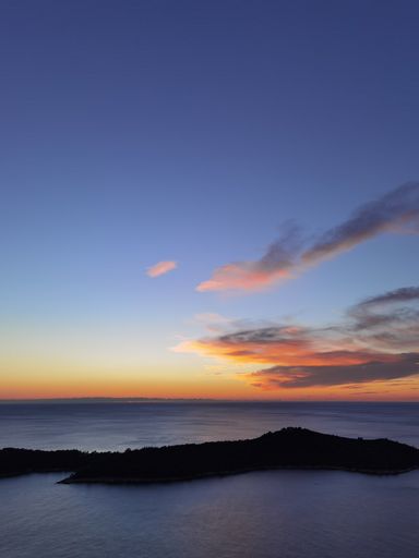 A vertical shot of a beautiful sunset over the sea