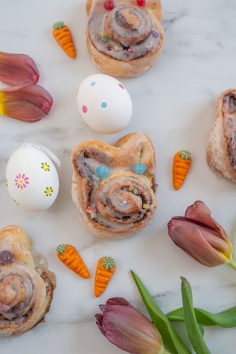 A closeup of easter cinnamon buns on a white table