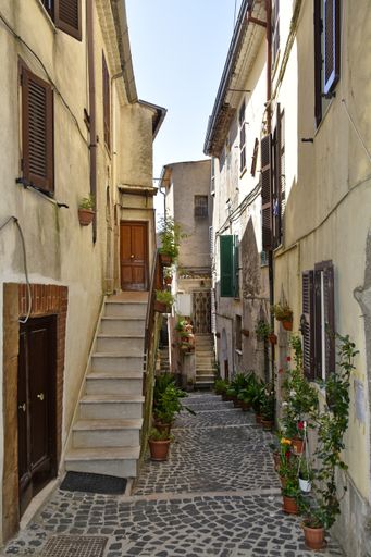 A vertical shot of a narrow street in Giuliano di Roma, a village in the Lazio region of Italy
