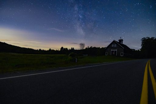 The beautiful view of Milky way over a barn