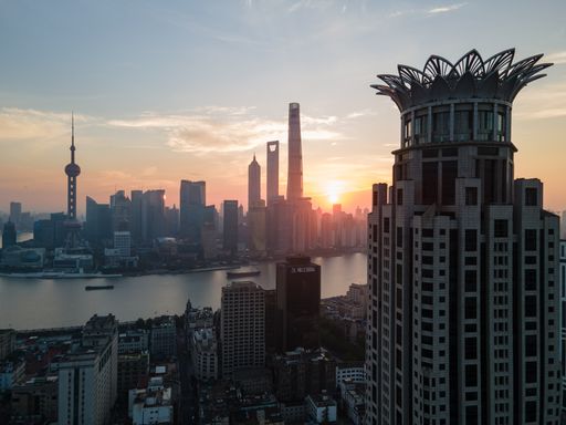 An aerial shot of the buildings and tower of Shanghai, China