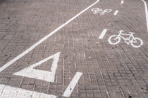 A closeup of an exclusive bicycle lane on an asphalt road in the street