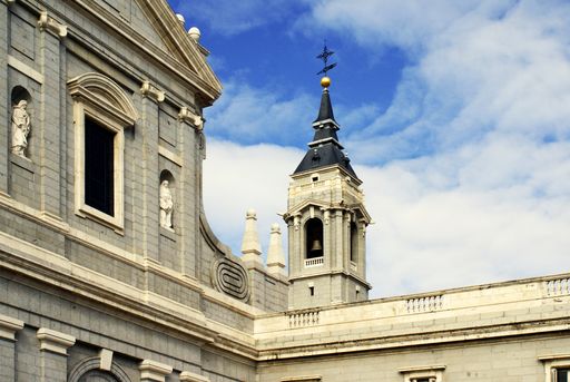 A closeup picture of mesmerizing Almudena Cathedral under the great sky in Madrid, Spain