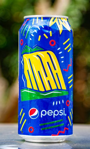 A vertical shot of a blue Pepsi can