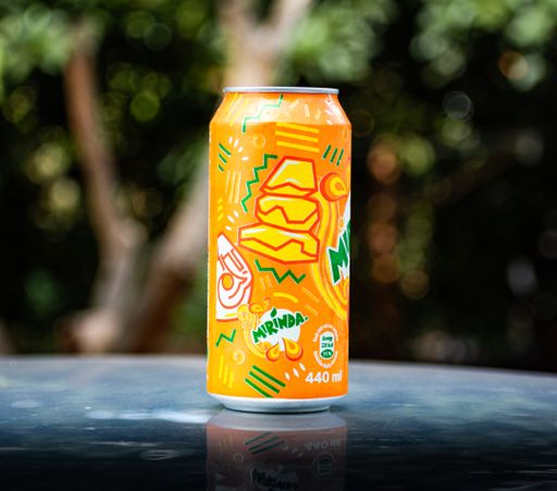 An aluminum can of orange Miranda in zim campaign on a blurred background