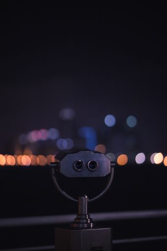 Shallow focus on a tower viewer With bokeh lights at night in Baku, Azerbaijan