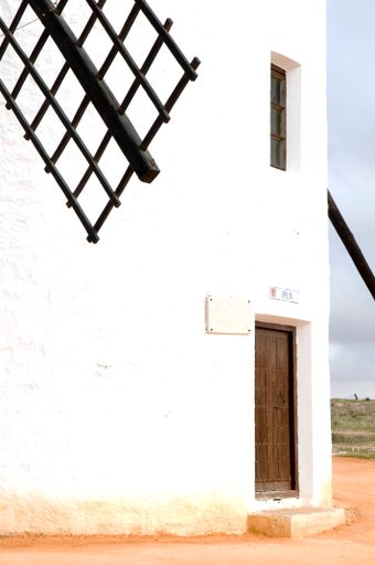 A vertical shot of a Spanish windmill in Campo de Criptana