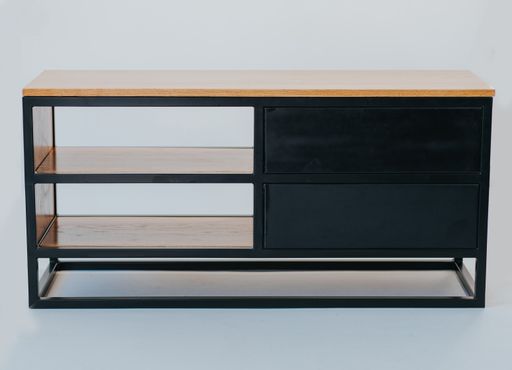 A closeup shot of modern wooden tv stand with drawers isolated on a white background