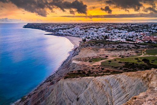 A mesmerizing sunset view of the sea and Lagos, Praia Da Luz in summer