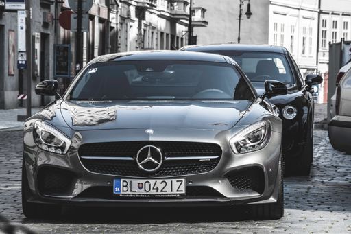 A modern gray fast car parked in the street. Mercedes Benz C120 AMG GT