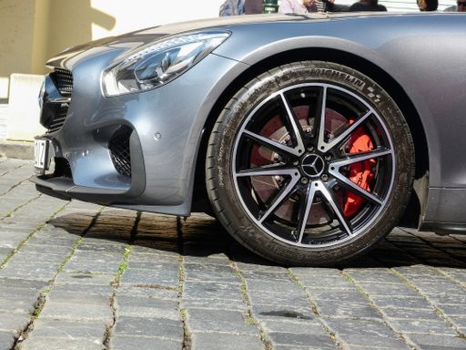 A modern gray fast car parked in the street. Mercedes Benz C120 AMG GT