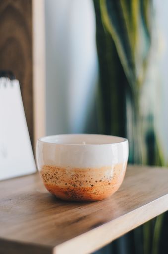 An aromatic candle on the shelf