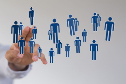 A 3D render of team communication and abstract social network connection symbols on a male hand with a blurry background