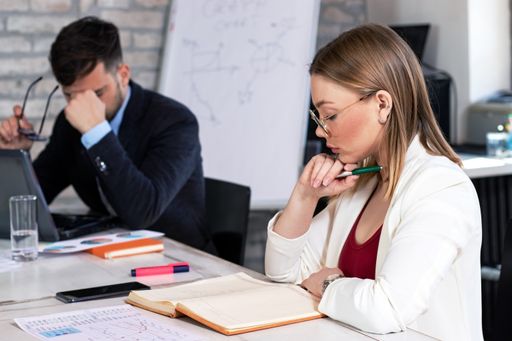 A group of successful young business partners having a meeting and discussing new business project ideas in an office - startup business concept