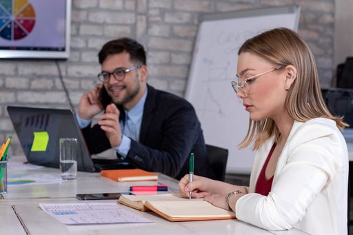 A group of successful young business partners having a meeting and discussing new business project ideas in an office - startup business concept