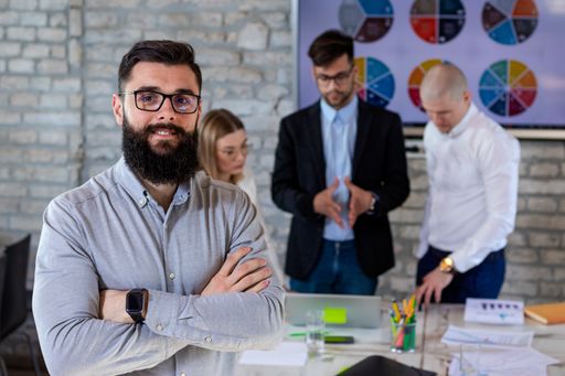 A group of successful young business partners having a meeting and discussing new business project ideas in an office - startup business concept