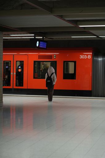 Man waiting for metro in Helsinki Metro station