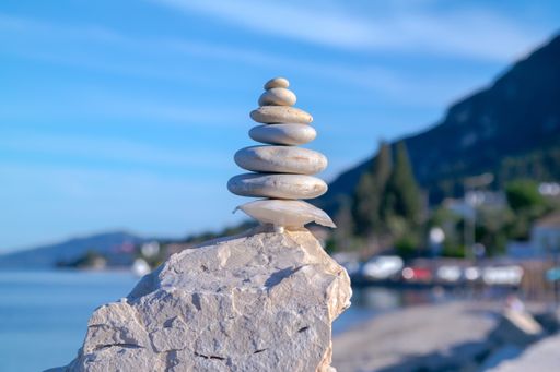 A closeup shot of pebbles balanced on each other on a rock