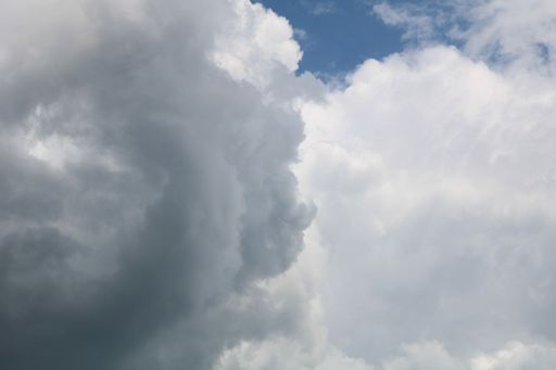A beautiful low angle shot of large cumulative clouds in the sky during a gloomy day