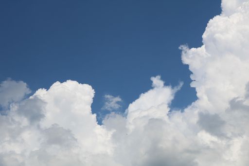A beautiful low angle shot of large cumulative clouds in the sky during a gloomy day