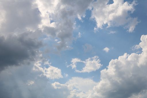A beautiful low angle shot of large cumulative clouds in the sky during a gloomy day