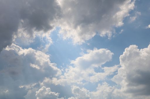 A beautiful low angle shot of large cumulative clouds in the sky during a gloomy day