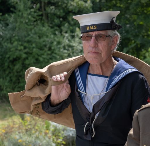 A 1940's sailor with kitbag over his shoulder at a World War 2 reenactment day.