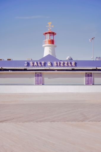 A vertical shot of a lighthouse in the Coney Island, New York