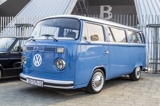 A blue Volkswagen T2 vintage passenger van on classical car exhibition