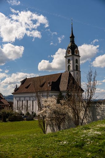 A vertical shot of the old church under the blue cloudy sky