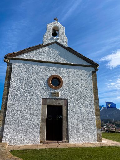 A vertical closeup of the Ermita de la Guia chapel in Ribadesella, Asturias, Spain