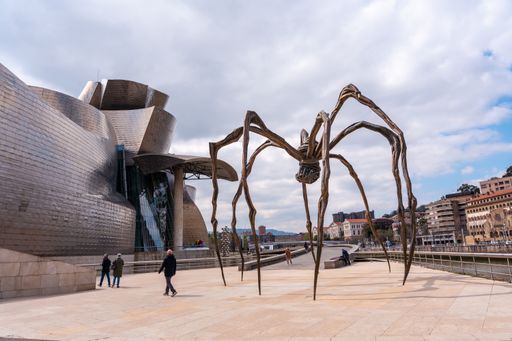 The Spider sculpture next to the Guggenheim museum in the city of Bilbao on a cloudy spring morning, Vizcaya. Basque Country