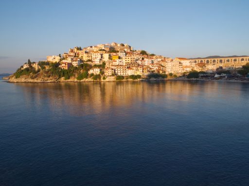 An amazing view from the sea of Kavala old town and the Byzantine fortress on the hill of Panagia, Greece