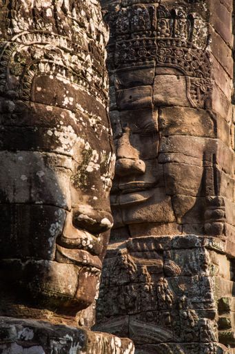 A vertical shot of statue details on the Angkor Wat Temple in Cambodia