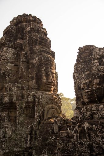 A vertical shot of statue details on the Angkor Wat Temple in Cambodia