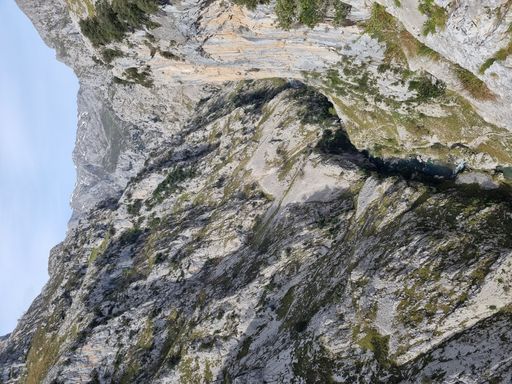 A vertical shot of a hiking trail on the mountains Ruta del Cares, Picos de Europa, Spain