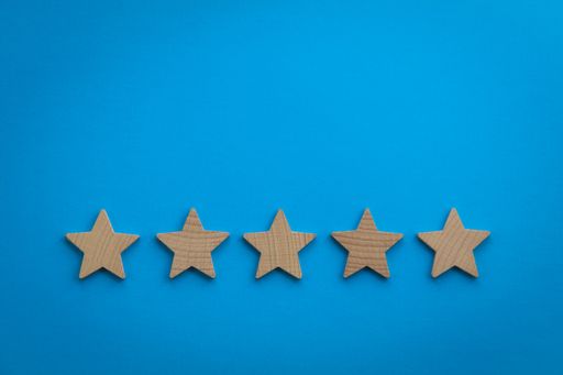 An overhead shot of five stars on a blue background