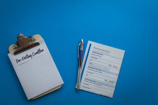 A doctor's prescription note and a pen on a blue background